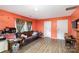 Living room with leather couch and wood floors at 12137 Renee Ford Rd, Stanfield, NC 28163