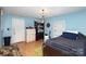 Bedroom with twin bed, dresser, and blue walls at 12137 Renee Ford Rd, Stanfield, NC 28163