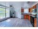 Kitchen with wood cabinets, stainless steel appliances, and vinyl flooring at 5115 Rosemede Dr, Charlotte, NC 28227