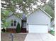 Ranch home with gray siding, attached garage, and landscaping at 5115 Rosemede Dr, Charlotte, NC 28227