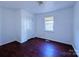 Bedroom with wood laminate flooring and closet at 5115 Rosemede Dr, Charlotte, NC 28227