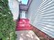 House entrance with red brick steps leading to the front door at 5115 Rosemede Dr, Charlotte, NC 28227