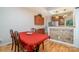 Bright dining area with a wooden table, red tablecloth and kitchen views at 324 W 10Th St, Charlotte, NC 28202