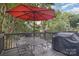 Deck features a table, chairs, umbrella, and grill at 324 W 10Th St, Charlotte, NC 28202