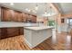 Modern kitchen with white island, stainless steel appliances, and hardwood floors at 10273 Lakeshore Dr, Lancaster, SC 29720