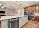 Modern kitchen with white island, stainless steel appliances, and hardwood floors at 10273 Lakeshore Dr, Lancaster, SC 29720