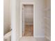 Clean bathroom with white pedestal sink and walk-in closet at 515 Tates Trl # 39, Cramerton, NC 28032