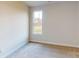 Cozy bedroom with neutral walls, carpet, and a window offering natural light at 515 Tates Trl # 39, Cramerton, NC 28032