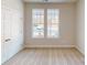 Well-lit bedroom with double doors and neutral wall-to-wall carpeting at 515 Tates Trl # 39, Cramerton, NC 28032