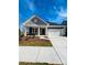 Newly built home with gray siding, white trim, and a two-car garage at 515 Tates Trl # 39, Cramerton, NC 28032