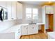 Bright kitchen with white cabinets, quartz countertops, and a large window at 515 Tates Trl # 39, Cramerton, NC 28032