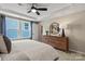 Main bedroom with dresser and plenty of natural light at 15010 Caspian Way, Charlotte, NC 28278