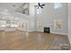 Open floor plan with high ceilings, hardwood floors, and a fireplace at 8012 Deerbridge St # 75, Mint Hill, NC 28227