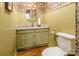 Charming powder room with updated vanity and patterned wallpaper at 1536 Carodon Ct, Rock Hill, SC 29732