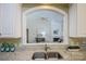 Kitchen features granite countertops, double sink, and a pass-through window overlooking the Gathering room at 5066 Ashford Crest Ln, Charlotte, NC 28226