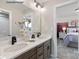 Double vanity bathroom with light brown cabinets and view to bedroom at 2009 Clapham Ct # Ken0098, Charlotte, NC 28215