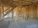 Unfinished interior framing with staircase at 2009 Clapham Ct # Ken0098, Charlotte, NC 28215