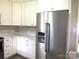 Modern kitchen with white cabinets, stainless steel appliances, and marble countertops at 1825 Bennett Rd, Lancaster, SC 29720