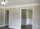 Clean hallway with neutral paint and hardwood flooring at 1825 Bennett Rd, Lancaster, SC 29720