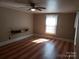 Bright bedroom with hardwood floors and a ceiling fan at 142 Alsace St, Mount Holly, NC 28120