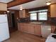 Kitchen with light-colored cabinets, laminate countertops, and white appliances at 142 Alsace St, Mount Holly, NC 28120