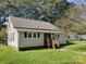 One-story home with small wooden deck at 142 Alsace St, Mount Holly, NC 28120