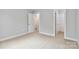 Spacious bedroom with neutral walls, carpeting, and a large closet at 1038 Heath Helms Rd, Monroe, NC 28110