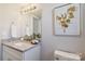 Clean bathroom boasts granite countertop, white vanity, and elegant mirror at 1038 Heath Helms Rd, Monroe, NC 28110