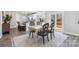 Charming dining area with table and chairs near kitchen and back door at 1038 Heath Helms Rd, Monroe, NC 28110