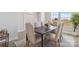 Bright dining room features a table with six chairs and large windows at 1038 Heath Helms Rd, Monroe, NC 28110