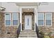 Inviting front entrance with stone accents at 1038 Heath Helms Rd, Monroe, NC 28110