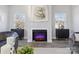 Modern fireplace with an electric flame and black cabinets at 1038 Heath Helms Rd, Monroe, NC 28110