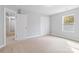 Bright bedroom with neutral carpeting and double closets at 1038 Heath Helms Rd, Monroe, NC 28110
