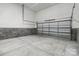 Spacious garage with overhead storage and concrete floor at 1038 Heath Helms Rd, Monroe, NC 28110