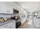 Modern kitchen with white cabinets and granite countertops at 1038 Heath Helms Rd, Monroe, NC 28110