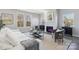Spacious living room with fireplace, comfy seating, and large windows at 1038 Heath Helms Rd, Monroe, NC 28110