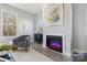 Relaxing living room with fireplace and comfortable armchair near windows at 1038 Heath Helms Rd, Monroe, NC 28110