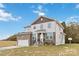 Two-story house with stone accents and a two-car garage at 1038 Heath Helms Rd, Monroe, NC 28110