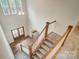 View of a grand staircase with wooden railing and carpet at 206 Streamwood Rd # 32, Troutman, NC 28166