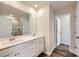 Double vanity bathroom with a shower and neutral tile at 9753 Inkberry Dr, Gastonia, NC 28056