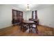 Formal dining room featuring hardwood floors and period-specific furniture at 109 N York St, Lancaster, SC 29720