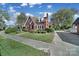 Red brick house with a blue door and a well-maintained lawn at 109 N York St, Lancaster, SC 29720