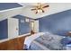 Serene bedroom with hardwood floors and blue walls at 109 N York St, Lancaster, SC 29720
