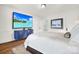 Bright bedroom with large TV, hardwood floors, and plenty of space at 109 N York St, Lancaster, SC 29720