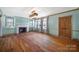 Spacious living room with hardwood floors, fireplace and natural light at 109 N York St, Lancaster, SC 29720