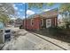 Brick home showcasing a side view, additional parking and landscaping at 109 N York St, Lancaster, SC 29720