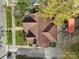 Aerial view of a house with brown roof, showcasing its layout and landscaping at 109 N York St, Lancaster, SC 29720