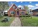 Brick house with a charming front porch and brick walkway at 109 N York St, Lancaster, SC 29720