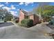 Brick home showcasing a side view, additional parking, and landscaping at 109 N York St, Lancaster, SC 29720