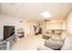 Finished basement recreation room with sectional sofa and large TV at 2640 Ironwood Dr, Hickory, NC 28602